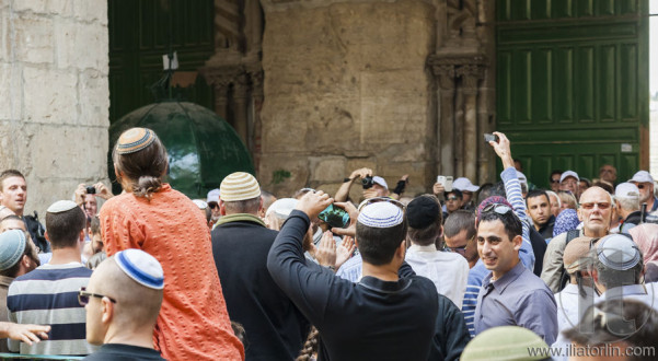 People celebrate near exit from Temple Mount. Jerusalem, Israel.